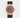 2023 Rolex Sky-Dweller 42 326235 watch featuring a chocolate brown dial, 18k Everose gold fluted Ring Command bezel, and black Oysterflex strap isolated on a light gray background