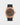 2023 Rolex Sky-Dweller 42 326235 watch featuring a chocolate brown dial, 18k Everose gold fluted Ring Command bezel, and black Oysterflex strap isolated on a light gray background
