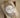 Angled view of the pre-owned 2018 Rolex Datejust 41 reference 126333 resting on a cushion, showing the silver baton dial, date window, and yellow gold fluted bezel