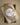 Angled view of the pre-owned 2018 Rolex Datejust 41 reference 126333 resting on a cushion, showing the silver baton dial, date window, and yellow gold fluted bezel
